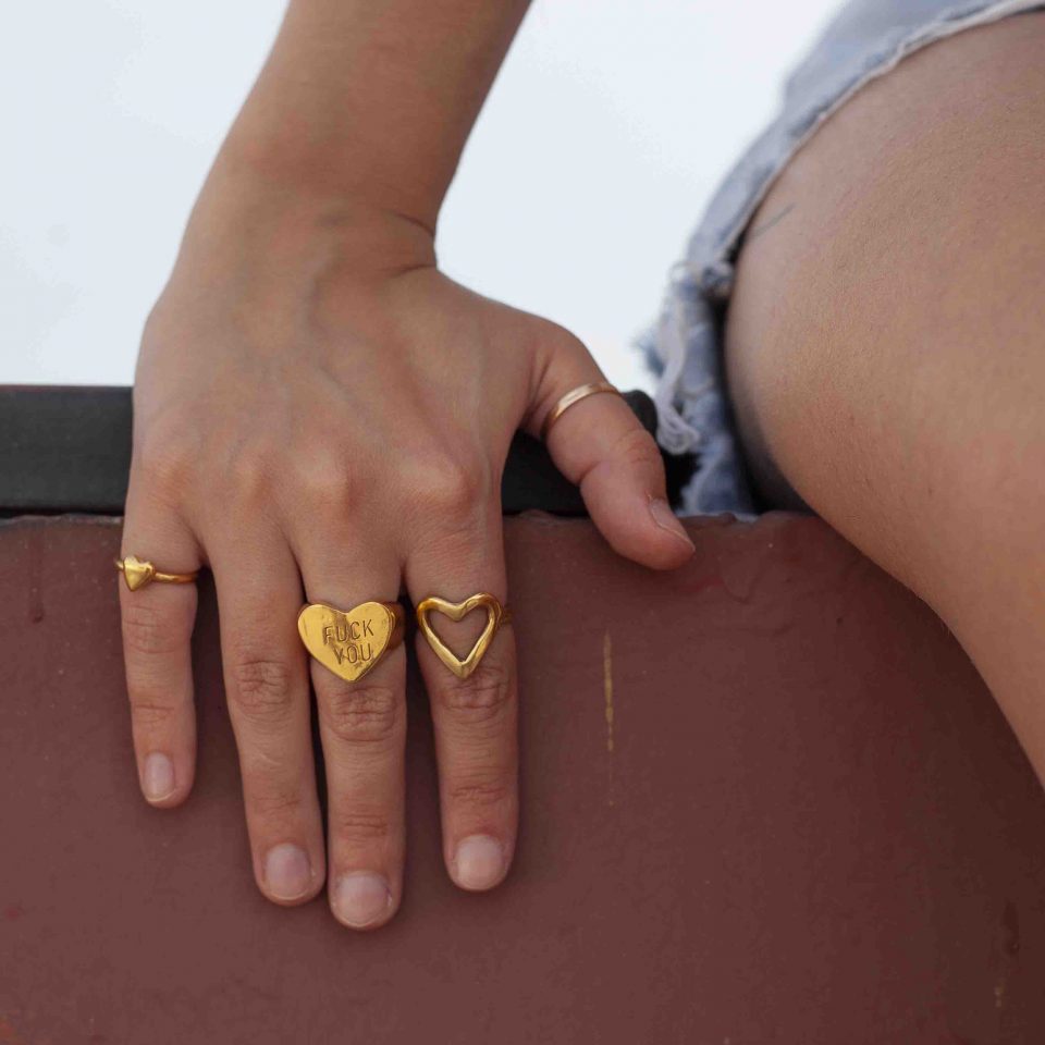 fuck you ring, harden my heart, handmade by kontis, handmade jewelry 24K gold plated brass, high quality, made in athens, brass heart ring, fuck you ring in hand
