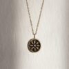 Kid of the Sun necklace with stainless steel chain and handmade brass sun pendant with patina finish. Unique artisan jewelry inspired by celestial symbols, bohemian wearable art, affordable handmade accessory by Sunny Designs small business.Κολιέ Kid of the Sun με ατσάλινη αλυσίδα και χειροποίητο μενταγιόν ήλιου από ορείχαλκο με πατίνα. Μοναδικό χειροποίητο κόσμημα εμπνευσμένο από τα ουράνια σύμβολα, μποέμ φορετή τέχνη, προσιτό αξεσουάρ από τη μικρή επιχείρηση Sunny Designs.
