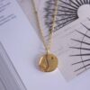 Yin Yang necklace, handmade pendant in 24k gold plated brass with black and white enamel design, symbolic spiritual jewelry representing balance and harmony, boho chic necklace on stainless steel chain by Sunny DesignsΧειροποίητο κολιέ Yin Yang από επιχρυσωμένο ορείχαλκο, μοναδικό bohemian artisan jewelry εμπνευσμένο από την ανατολική φιλοσοφία, πνευματικό χειροποίητο κόσμημα Sunny Designs