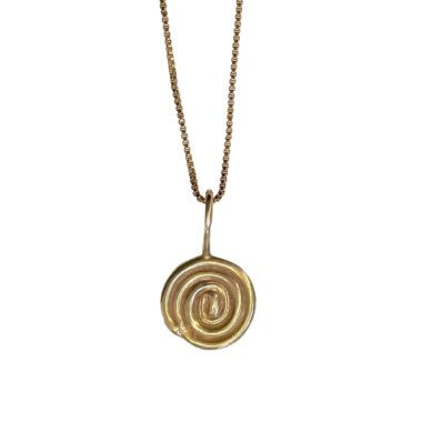 A close-up image of a circular spiral necklace made of brass, featuring a luxurious 24k goldplated finish. The necklace is elegantly crafted with a stainless steel chain, exuding a blend of sophistication and timeless style.