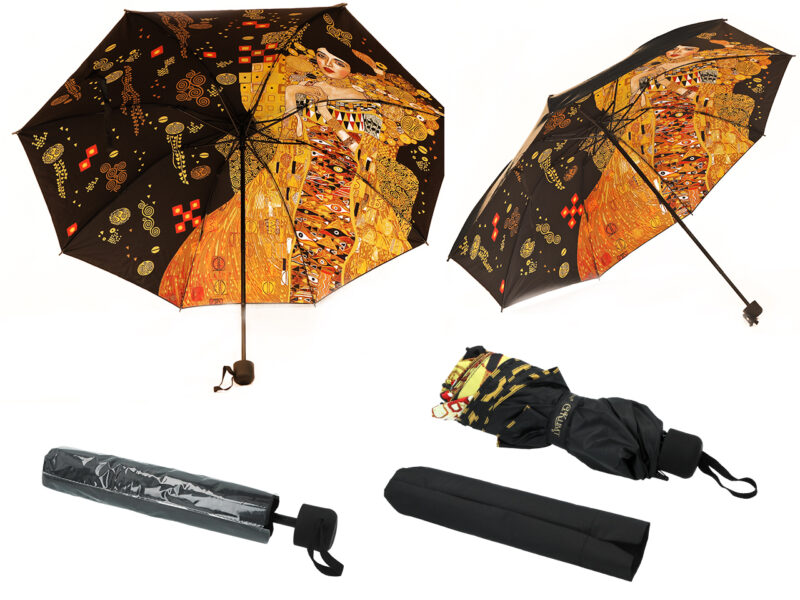 "Elevate your rainy day style with our automatic folding umbrella adorned with the iconic G. Klimt 'Adele Bloch-Bauer' design inside. This compact and stylish umbrella by Carmani adds a touch of art to your everyday essentials." "Αναβαθμίστε το στυλ σας τις βροχερές ημέρες με το αυτόματο και αναδιπλούμενο ομπρέλα διακοσμημένο με το εμβληματικό σχέδιο του G. Klimt 'Adele Bloch-Bauer' στο εσωτερικό, από την Carmani. Αυτή η συμπαγής και κομψή ομπρέλα προσθέτει μια νότα τέχνης στα καθημερινά σας αξεσουάρ."