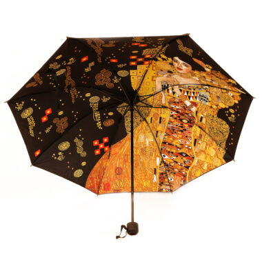 "Elevate your rainy day style with our automatic folding umbrella adorned with the iconic G. Klimt 'Adele Bloch-Bauer' design inside. This compact and stylish umbrella by Carmani adds a touch of art to your everyday essentials." "Αναβαθμίστε το στυλ σας τις βροχερές ημέρες με το αυτόματο και αναδιπλούμενο ομπρέλα διακοσμημένο με το εμβληματικό σχέδιο του G. Klimt 'Adele Bloch-Bauer' στο εσωτερικό, από την Carmani. Αυτή η συμπαγής και κομψή ομπρέλα προσθέτει μια νότα τέχνης στα καθημερινά σας αξεσουάρ."