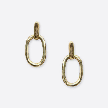 Oval Essence Image description: A pair of striking earrings featuring bold oval-shaped elements hanging elegantly from hooks. The earrings command attention with their sleek and modern design, elevating any outfit with a touch of contemporary flair.