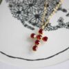 Heavenly Cross necklace with red stone, handmade artisan pendant in 24k gold plated brass on durable stainless steel chain, symbolic spiritual jewelry, boho cross necklace, unique handmade small business accessory by Sunny Designs Χειροποίητο κολιέ σταυρός Heavenly Cross με κόκκινη πέτρα, επιχρυσωμένο μενταγιόν από ορείχαλκο, ατσάλινη αλυσίδα, affordable bohemian artisan jewelry, συμβολικό κόσμημα πίστης από τη Sunny Designs
