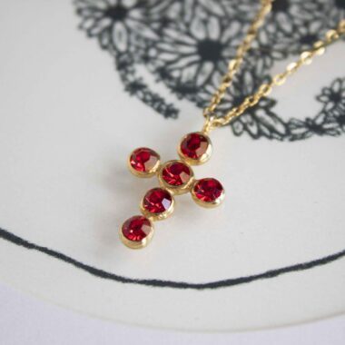 Heavenly Cross necklace with red stone, handmade artisan pendant in 24k gold plated brass on durable stainless steel chain, symbolic spiritual jewelry, boho cross necklace, unique handmade small business accessory by Sunny Designs Χειροποίητο κολιέ σταυρός Heavenly Cross με κόκκινη πέτρα, επιχρυσωμένο μενταγιόν από ορείχαλκο, ατσάλινη αλυσίδα, affordable bohemian artisan jewelry, συμβολικό κόσμημα πίστης από τη Sunny Designs