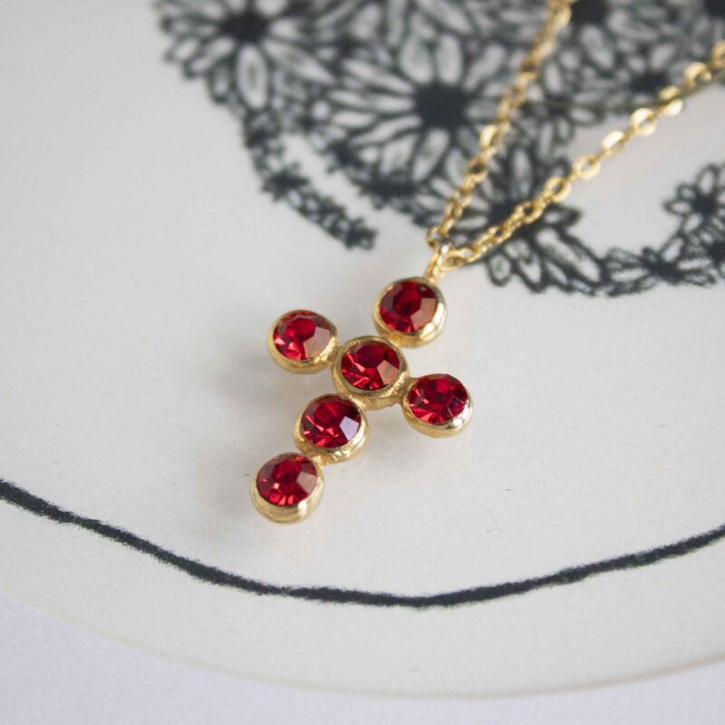 Heavenly Cross necklace with red stone, handmade artisan pendant in 24k gold plated brass on durable stainless steel chain, symbolic spiritual jewelry, boho cross necklace, unique handmade small business accessory by Sunny Designs Χειροποίητο κολιέ σταυρός Heavenly Cross με κόκκινη πέτρα, επιχρυσωμένο μενταγιόν από ορείχαλκο, ατσάλινη αλυσίδα, affordable bohemian artisan jewelry, συμβολικό κόσμημα πίστης από τη Sunny Designs