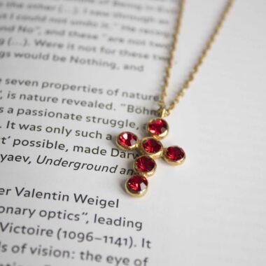 Heavenly Cross necklace with red stone, handmade artisan pendant in 24k gold plated brass on durable stainless steel chain, symbolic spiritual jewelry, boho cross necklace, unique handmade small business accessory by Sunny Designs Χειροποίητο κολιέ σταυρός Heavenly Cross με κόκκινη πέτρα, επιχρυσωμένο μενταγιόν από ορείχαλκο, ατσάλινη αλυσίδα, affordable bohemian artisan jewelry, συμβολικό κόσμημα πίστης από τη Sunny Designs