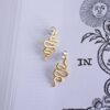 Spiral Serpent stud earrings, handmade brass earrings with symbolic spiral snake design. Unique artisan statement jewelry inspired by mythology and nature, affordable wearable art by Sunny Designs small business. Σκουλαρίκια Spiral Serpent καρφωτά, χειροποίητα σκουλαρίκια από ορείχαλκο με συμβολικό σχέδιο σπείρας φιδιού. Μοναδικά statement κοσμήματα εμπνευσμένα από τη μυθολογία και τη φύση, προσιτά χειροποίητα έργα τέχνης από τη μικρή επιχείρηση Sunny Designs.