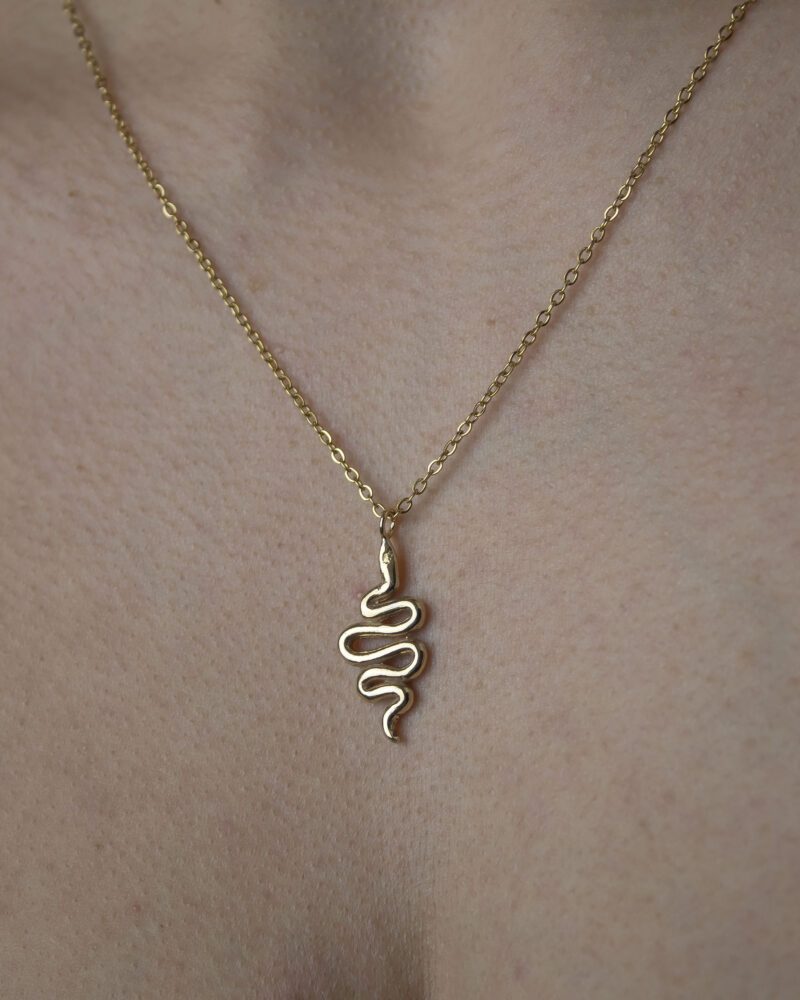 Small snake necklace, handmade serpent pendant in 24k gold plated brass on stainless steel chain, symbolic snake jewelry, boho chic necklace, unique handmade small business accessory by Sunny Designs Κολιέ Small Snake, χειροποίητο μενταγιόν φιδιού από ορείχαλκο επιχρυσωμένο 24 καράτια σε ατσάλινη αλυσίδα, συμβολικό κόσμημα, boho χειροποίητο αξεσουάρ από τη Sunny Designs