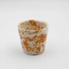Handmade ceramic cup featuring vibrant and colorful dots, adding a playful and artistic touch to the design. Χειροποίητο κεραμικό φλιτζάνι με ζωηρά και πολύχρωμα σημεία, προσθέτοντας μια παιχνιδιάρικη και καλλιτεχνική πινελιά στον σχεδιασμό.