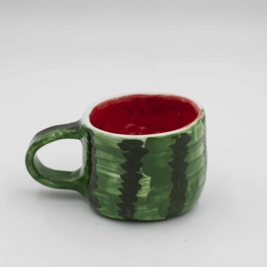 Handmade ceramic watermelon mug, perfect for adding a refreshing touch to your drinkware collection. This artisanal mug features a vibrant watermelon design with intricate details, ideal for enjoying your favorite beverages. Unique and colorful, this watermelon-themed mug is a delightful addition to any kitchen or dining space.Χειροποίητη κεραμική κούπα με σχέδιο καρπουζιού, ιδανική για να προσθέσετε μια δροσερή πινελιά στη συλλογή σας από σκεύη. Αυτή η καλλιτεχνική κούπα διαθέτει ζωντανό σχέδιο καρπουζιού με περίτεχνες λεπτομέρειες, ιδανική για να απολαμβάνετε τα αγαπημένα σας ροφήματα. Μοναδική και πολύχρωμη, αυτή η κούπα με θέμα το καρπούζι είναι μια υπέροχη προσθήκη σε κάθε κουζίνα ή τραπεζαρία.