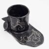 Black ceramic mug with curved floral design, paired with a matching black saucer. Perfect for enjoying your favorite beverage in style. keywords: black mug, floral mug, curved flowers, mug with saucer, ceramic mug Μαύρο φλιτζάνι από κεραμικό με ανάγλυφο floral σχέδιο, μαζί με μαύρο πιατάκι. Ιδανικό για να απολαύσετε το αγαπημένο σας ρόφημα με στυλ. keywords: μαύρο φλιτζάνι, floral φλιτζάνι, ανάγλυφα λουλούδια, φλιτζάνι με πιατάκι, κεραμικό φλιτζάνι