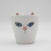 Meow-gical mug! This handcrafted ceramic cup features a playful sculpted cat snout, perfect for cat lovers and anyone who enjoys a touch of whimsy with their morning coffee. (keywords: mug, cat mug, ceramic mug, handmade mug, sculpted cat, coffee mug) Μαγικό φλιτζάνι! Αυτό το χειροποίητο κεραμικό φλιτζάνι διαθέτει μια παιχνιδιάρικη, γλυπτή γάτα, ιδανικό για τους λάτρεις των γατών και όποιον απολαμβάνει μια πινελιά φαντασίας με τον πρωινό του καφέ. (keywords: φλιτζάνι, φλιτζάνι γάτας, κεραμικό φλιτζάνι, χειροποίητο φλιτζάνι, γλυπτή γάτα, φλιτζάνι καφέ κούπα)