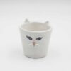 Meow-gical mug! This handcrafted ceramic cup features a playful sculpted cat snout, perfect for cat lovers and anyone who enjoys a touch of whimsy with their morning coffee. (keywords: mug, cat mug, ceramic mug, handmade mug, sculpted cat, coffee mug) Μαγικό φλιτζάνι! Αυτό το χειροποίητο κεραμικό φλιτζάνι διαθέτει μια παιχνιδιάρικη, γλυπτή γάτα, ιδανικό για τους λάτρεις των γατών και όποιον απολαμβάνει μια πινελιά φαντασίας με τον πρωινό του καφέ. (keywords: φλιτζάνι, φλιτζάνι γάτας, κεραμικό φλιτζάνι, χειροποίητο φλιτζάνι, γλυπτή γάτα, φλιτζάνι καφέ κούπα)