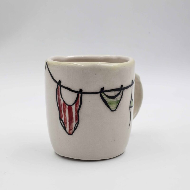 Handmade ceramic mug painted with a pencil, featuring summer-themed designs such as bikinis, shells, wine, and fruits. This vibrant and artistic mug adds a touch of summer fun and relaxation to your drinkware collection, perfect for enjoying your favorite beverages. Χειροποίητη κεραμική κούπα ζωγραφισμένη με μολύβι, με καλοκαιρινά σχέδια όπως μαγιό, κοχύλια, κρασί και φρούτα. Αυτή η ζωντανή και καλλιτεχνική κούπα προσθέτει μια πινελιά καλοκαιρινής διασκέδασης και χαλάρωσης στη συλλογή σας από ποτήρια, ιδανική για να απολαύσετε τα αγαπημένα σας ποτά.