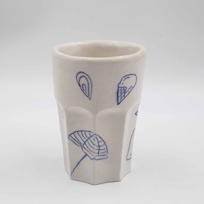 Handmade ceramic mug painted with a pencil, featuring summer-themed designs such as bikinis, shells, wine, and fruits. This vibrant and artistic mug adds a touch of summer fun and relaxation to your drinkware collection, perfect for enjoying your favorite beverages. Χειροποίητη κεραμική κούπα ζωγραφισμένη με μολύβι, με καλοκαιρινά σχέδια όπως μαγιό, κοχύλια, κρασί και φρούτα. Αυτή η ζωντανή και καλλιτεχνική κούπα προσθέτει μια πινελιά καλοκαιρινής διασκέδασης και χαλάρωσης στη συλλογή σας από ποτήρια, ιδανική για να απολαύσετε τα αγαπημένα σας ποτά.