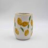 Handmade ceramic mug painted with vibrant lemons, adding a fresh and cheerful touch to your drinkware collection. Perfect for enjoying coffee, tea, or any favorite beverage, this unique and artistic mug brings a taste of summer to your everyday routine. Χειροποίητη κεραμική κούπα ζωγραφισμένη με ζωηρά λεμόνια, προσθέτοντας μια φρέσκια και χαρούμενη πινελιά στη συλλογή σας από ποτήρια. Ιδανική για να απολαύσετε καφέ, τσάι ή οποιοδήποτε αγαπημένο ποτό, αυτή η μοναδική και καλλιτεχνική κούπα φέρνει μια γεύση καλοκαιριού στην καθημερινότητά σας.