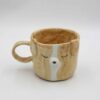 Whimsical handmade ceramic mug featuring a charming dog face design. Perfect for dog lovers and coffee enthusiasts. Φανταστικό χειροποίητο κεραμικό φλιτζάνι με γοητευτικό σχέδιο προσώπου σκύλου. Ιδανικό για λάτρεις των σκύλων και του καφέ.