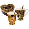 set of mugs, Klimt mugs, The Kiss mug, The Tree of Life mug, art-inspired mugs, mugs with spoons, decorative gift box mugs, elegant mugs, Gustav Klimt gift, This set of two elegant mugs with spoons, inspired by Gustav Klimt's artworks "The Kiss" and "The Tree of Life," is packaged in a decorative gift box. Capacity 280 ml * 2. Greek: σετ κούπες, κούπες Klimt, κούπα The Kiss, κούπα The Tree of Life, κούπες εμπνευσμένες από την τέχνη, κούπες με κουτάλια, διακοσμητική συσκευασία δώρου, κομψές κούπες, δώρο Gustav Klimt, Αυτό το σετ από δύο κομψές κούπες με κουτάλια, εμπνευσμένο από τα έργα του Gustav Klimt "The Kiss" και "The Tree of Life", είναι συσκευασμένο σε διακοσμητική συσκευασία δώρου. Χωρητικότητα 280 ml * 2.