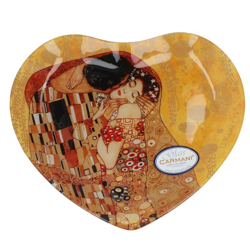 Decorative plate heart - G. Klimt, The Kiss, 24.5x23cm (CARMANI). A stunning heart-shaped decorative plate featuring Gustav Klimt's iconic masterpiece The Kiss. Made with high-quality materials, it serves as both an elegant decoration and a functional piece for special occasions. An excellent gift for art lovers. Keywords: decorative plate, heart-shaped plate, Gustav Klimt, The Kiss, art-inspired home decor, elegant gift, Carmani collection.Διακοσμητική πιατέλα καρδιά - G. Klimt, Το Φιλί, 24.5x23cm (CARMANI). Μια εντυπωσιακή διακοσμητική πιατέλα σε σχήμα καρδιάς, εμπνευσμένη από το αριστούργημα Το Φιλί του Gustav Klimt. Κατασκευασμένη από υλικά υψηλής ποιότητας, μπορεί να χρησιμοποιηθεί τόσο ως κομψό διακοσμητικό όσο και ως λειτουργικό κομμάτι για ιδιαίτερες περιστάσεις. Ιδανικό δώρο για λάτρεις της τέχνης. Λέξεις-κλειδιά: διακοσμητική πιατέλα, πιατέλα καρδιά, Gustav Klimt, Το Φιλί, διακόσμηση εμπνευσμένη από την τέχνη, κομψό δώρο, συλλογή Carmani