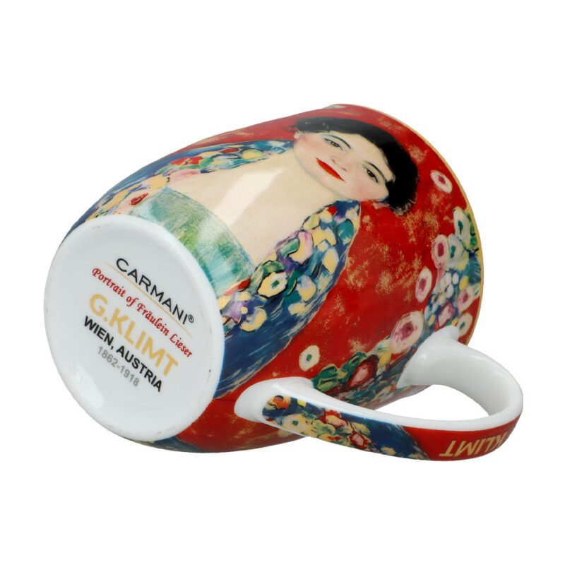 Camio mug - G. Klimt, Portrait of Fräulein Lieser (CARMANI). This elegant mug showcases Gustav Klimt’s captivating portrait of Fräulein Lieser. Crafted from high-quality porcelain, it reflects the artist’s distinctive style and adds a touch of art to your daily routine. Produced by Carmani, this limited edition piece is perfect for art lovers and collectors. 400ml capacity. Κούπα Camio - Γκ. Κλιμτ, Πορτραίτο της Φράου Λίζερ (CARMANI). Αυτή η κομψή κούπα παρουσιάζει το μαγευτικό πορτραίτο της Φράου Λίζερ από τον Γκ. Κλιμτ. Κατασκευασμένη από υψηλής ποιότητας πορσελάνη, αντανακλά το μοναδικό στυλ του καλλιτέχνη και προσθέτει μια πινελιά τέχνης στην καθημερινότητά σας. Παραγωγής Carmani, αυτή η περιορισμένης έκδοσης κούπα είναι ιδανική για τους λάτρεις της τέχνης και τους συλλέκτες. Χωρητικότητα 400ml. Camio mug, Gustav Klimt, Portrait of Fräulein Lieser, art mug, limited edition mug, porcelain mug, Carmani mug, luxury mug, Klimt mug, κούπα, Πορτραίτο της Φράου Λίζερ, Κλιμτ, πορσελάνη, περιορισμένη έκδοση, κούπα τέχνης.