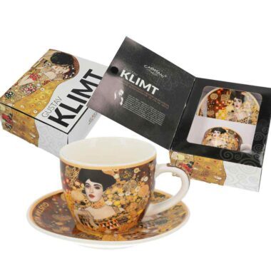 Espresso cup with saucer - G. Klimt, Adele (CARMANI). A luxurious espresso cup with a matching saucer, featuring Gustav Klimt’s iconic portrait Adele Bloch-Bauer. A perfect combination of art and elegance, ideal for coffee lovers and art enthusiasts. Comes in a beautiful gift box. Keywords: espresso cup, saucer, Gustav Klimt, Adele Bloch-Bauer, art-inspired tableware, elegant coffee set, Carmani collection, unique gift. Φλιτζάνι εσπρέσο με πιατάκι - G. Klimt, Adele (CARMANI). Ένα πολυτελές φλιτζάνι εσπρέσο με ασορτί πιατάκι, διακοσμημένο με το εμβληματικό πορτρέτο Adele Bloch-Bauer του Gustav Klimt. Ένας μοναδικός συνδυασμός τέχνης και κομψότητας, ιδανικός για τους λάτρεις του καφέ και της τέχνης. Συνοδεύεται από όμορφη συσκευασία δώρου. Λέξεις-κλειδιά: φλιτζάνι εσπρέσο, πιατάκι, Gustav Klimt, Adele Bloch-Bauer, σερβίτσιο εμπνευσμένο από την τέχνη, κομψό σετ καφέ, συλλογή Carmani, μοναδικό δώρο.