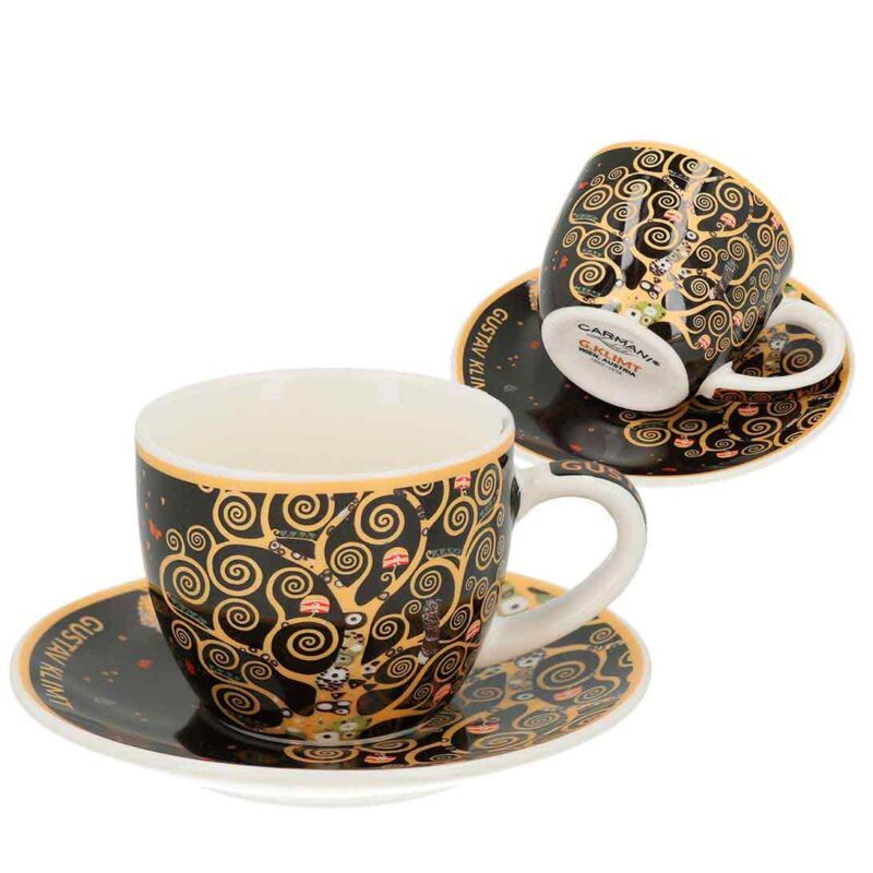 Espresso cup with saucer - G. Klimt, Tree of Life (CARMANI). An original espresso cup and saucer set for true espresso lovers and art enthusiasts. Featuring the iconic Tree of Life by Gustav Klimt, it offers a daily moment of luxury and art. Perfect for enjoying a cup of aromatic coffee while surrounded by beauty. Keywords: espresso cup, saucer, Gustav Klimt, Tree of Life, art-inspired coffee set, elegant tableware, Carmani collection, luxury gift, 80ml. Φλιτζάνι εσπρέσο με πιατάκι - G. Klimt, Tree of Life (CARMANI). Ένα αυθεντικό σετ φλιτζανιού εσπρέσο με πιατάκι για αληθινούς λάτρεις του εσπρέσο και της τέχνης του Gustav Klimt. Διακοσμημένο με το εμβληματικό έργο Tree of Life, προσφέρει κάθε μέρα μια στιγμή πολυτέλειας και τέχνης. Ιδανικό για να απολαύσετε έναν αρωματικό καφέ ενώ περιβάλλεστε από ομορφιά. Λέξεις-κλειδιά: φλιτζάνι εσπρέσο, πιατάκι, Gustav Klimt, Tree of Life, σερβίτσιο εμπνευσμένο από την τέχνη, κομψό σετ καφέ, συλλογή Carmani, πολυτελές δώρο, 80ml.