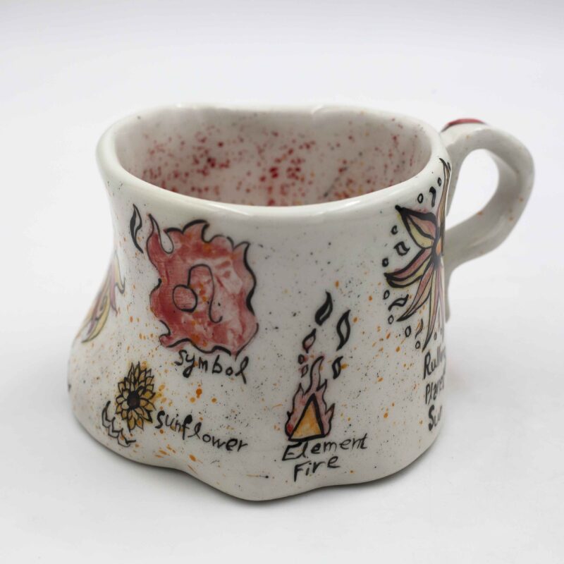 Unique handmade ceramic zodiac mugs, each crafted with artistic detail and vibrant paintings. Every mug features a different zodiac sign, showcasing its ruling planet, favorite flower, element, and symbol. A perfect astrology-inspired gift for horoscope lovers and collectors. Beautiful, functional, and one-of-a-kind ceramic art! Μοναδικές χειροποίητες κεραμικές κούπες ζωδίων, κάθε μία με ξεχωριστή καλλιτεχνική διακόσμηση και ζωηρές ζωγραφιές. Κάθε κούπα απεικονίζει ένα διαφορετικό ζώδιο, με τον κυβερνήτη πλανήτη του, το αγαπημένο του λουλούδι, το στοιχείο και το σύμβολό του. Ένα τέλειο δώρο για λάτρεις της αστρολογίας και συλλέκτες. Όμορφη, χρηστική και μοναδική κεραμική τέχνη!