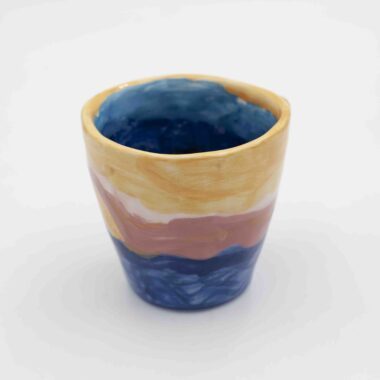 Handmade ceramic mug with a hand-painted sunset landscape, capturing warm hues and dreamy horizons. A unique coffee mug inspired by nature, perfect for tea or coffee lovers and an ideal gift.