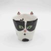 Adorable handmade ceramic cat mugs with a 3D snout and ears, bringing a playful and cozy touch to your coffee or tea time. Designed for cat lovers, these unique mugs combine artistic craftsmanship with functionality, making them the perfect gift or collectible piece. Χαριτωμένες χειροποίητες κεραμικές κούπες γάτας με τρισδιάστατη μουσούδα και αυτιά, που προσθέτουν μια παιχνιδιάρικη και ζεστή πινελιά στον καφέ ή το τσάι σας. Σχεδιασμένες για λάτρεις των γατών, αυτές οι μοναδικές κούπες συνδυάζουν την καλλιτεχνική δημιουργία με την πρακτικότητα, αποτελώντας το τέλειο δώρο ή συλλεκτικό κομμάτι.