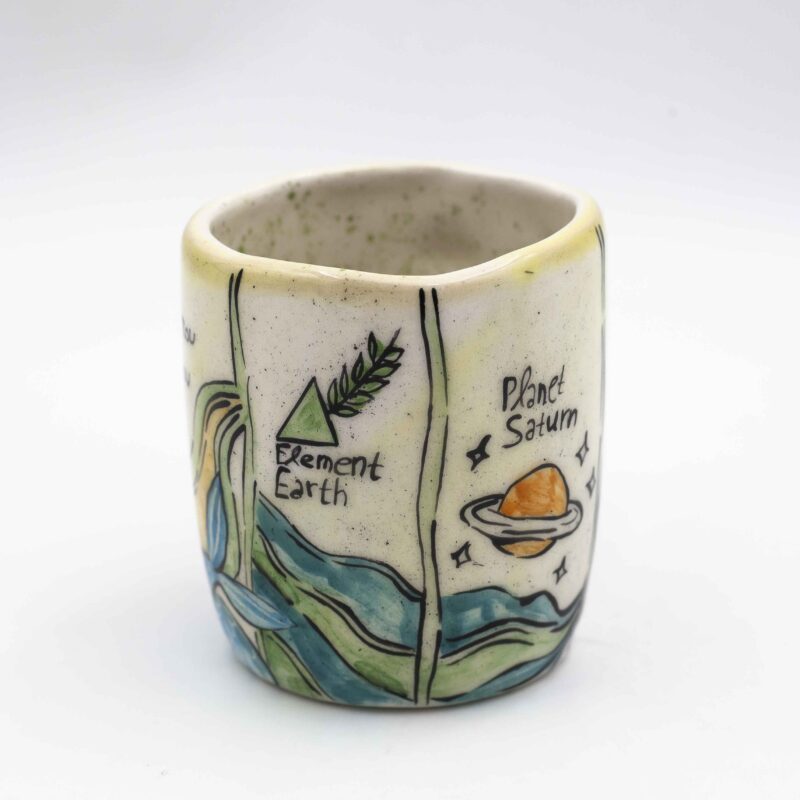 Unique handmade ceramic zodiac mugs, each crafted with artistic detail and vibrant paintings. Every mug features a different zodiac sign, showcasing its ruling planet, favorite flower, element, and symbol. A perfect astrology-inspired gift for horoscope lovers and collectors. Beautiful, functional, and one-of-a-kind ceramic art! Μοναδικές χειροποίητες κεραμικές κούπες ζωδίων, κάθε μία με ξεχωριστή καλλιτεχνική διακόσμηση και ζωηρές ζωγραφιές. Κάθε κούπα απεικονίζει ένα διαφορετικό ζώδιο, με τον κυβερνήτη πλανήτη του, το αγαπημένο του λουλούδι, το στοιχείο και το σύμβολό του. Ένα τέλειο δώρο για λάτρεις της αστρολογίας και συλλέκτες. Όμορφη, χρηστική και μοναδική κεραμική τέχνη!