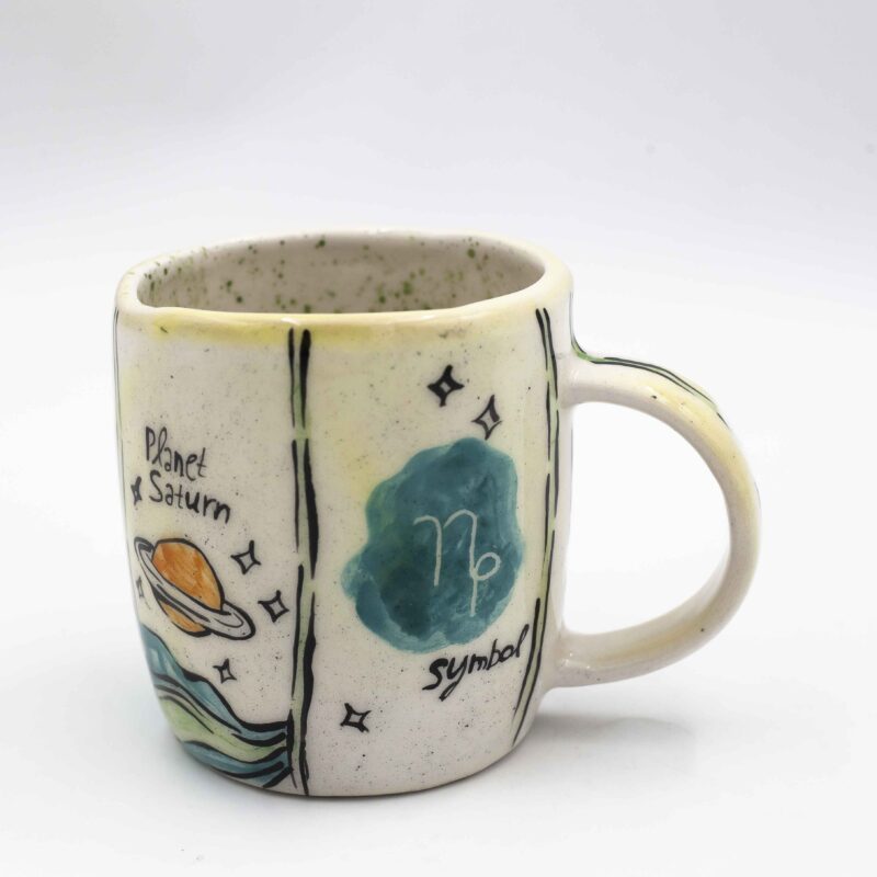 Unique handmade ceramic zodiac mugs, each crafted with artistic detail and vibrant paintings. Every mug features a different zodiac sign, showcasing its ruling planet, favorite flower, element, and symbol. A perfect astrology-inspired gift for horoscope lovers and collectors. Beautiful, functional, and one-of-a-kind ceramic art! Μοναδικές χειροποίητες κεραμικές κούπες ζωδίων, κάθε μία με ξεχωριστή καλλιτεχνική διακόσμηση και ζωηρές ζωγραφιές. Κάθε κούπα απεικονίζει ένα διαφορετικό ζώδιο, με τον κυβερνήτη πλανήτη του, το αγαπημένο του λουλούδι, το στοιχείο και το σύμβολό του. Ένα τέλειο δώρο για λάτρεις της αστρολογίας και συλλέκτες. Όμορφη, χρηστική και μοναδική κεραμική τέχνη!