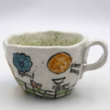 Unique handmade ceramic zodiac mugs, each crafted with artistic detail and vibrant paintings. Every mug features a different zodiac sign, showcasing its ruling planet, favorite flower, element, and symbol. A perfect astrology-inspired gift for horoscope lovers and collectors. Beautiful, functional, and one-of-a-kind ceramic art! Μοναδικές χειροποίητες κεραμικές κούπες ζωδίων, κάθε μία με ξεχωριστή καλλιτεχνική διακόσμηση και ζωηρές ζωγραφιές. Κάθε κούπα απεικονίζει ένα διαφορετικό ζώδιο, με τον κυβερνήτη πλανήτη του, το αγαπημένο του λουλούδι, το στοιχείο και το σύμβολό του. Ένα τέλειο δώρο για λάτρεις της αστρολογίας και συλλέκτες. Όμορφη, χρηστική και μοναδική κεραμική τέχνη!