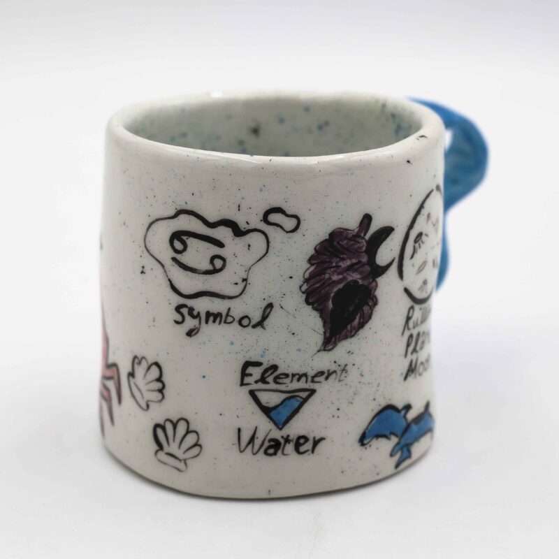 Unique handmade ceramic zodiac mugs, each crafted with artistic detail and vibrant paintings. Every mug features a different zodiac sign, showcasing its ruling planet, favorite flower, element, and symbol. A perfect astrology-inspired gift for horoscope lovers and collectors. Beautiful, functional, and one-of-a-kind ceramic art! Μοναδικές χειροποίητες κεραμικές κούπες ζωδίων, κάθε μία με ξεχωριστή καλλιτεχνική διακόσμηση και ζωηρές ζωγραφιές. Κάθε κούπα απεικονίζει ένα διαφορετικό ζώδιο, με τον κυβερνήτη πλανήτη του, το αγαπημένο του λουλούδι, το στοιχείο και το σύμβολό του. Ένα τέλειο δώρο για λάτρεις της αστρολογίας και συλλέκτες. Όμορφη, χρηστική και μοναδική κεραμική τέχνη!