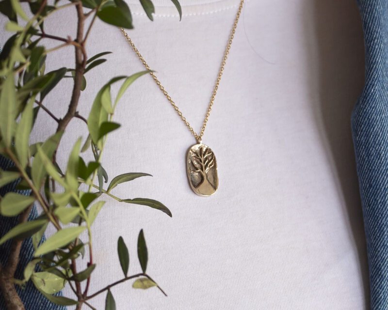 Tree of Life necklace, handmade 24k gold plated brass pendant with engraved tree design, symbolic jewelry representing growth, strength, family and connection, artisan boho chic necklace on stainless steel chain by Sunny Designs Χειροποίητο κολιέ Tree of Life με μενταγιόν χαραγμένο δέντρο από επιχρυσωμένο ορείχαλκο σε ατσάλινη αλυσίδα, μοναδικό συμβολικό bohemian κόσμημα, χειροποίητη δημιουργία μικρής επιχείρησης Sunny Designs