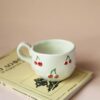 Handmade mug with 3d cherries. 3 sizes. 1 for espresso , 2 for capuccino, 3 for filter. χειροποίητη κεραμική κούπα με 3ντι κεράσια σε τρία μεγέθη. 1 για εσπρέσο, 2 για καπουτσίνο και 3 για φίλτρου.