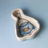 handmade ceramic ashtray with goldfish. χειροποίητο κεραμικό τασάκι με χρυσόψαρο σε σακούλα.