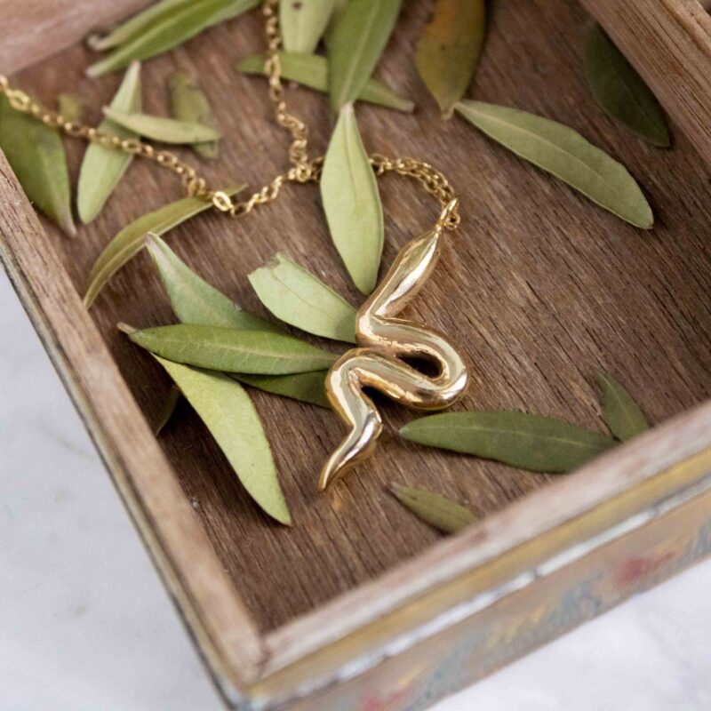 Big snake necklace, handmade large serpent pendant in 24k gold plated brass on stainless steel chain, symbolic snake jewelry, bold statement boho necklace, unique handmade small business accessory by Sunny Designs Κολιέ Big Snake, χειροποίητο μεγάλο μενταγιόν φιδιού από ορείχαλκο επιχρυσωμένο 24 καράτια σε ατσάλινη αλυσίδα, συμβολικό και μυστηριακό boho κόσμημα, μοναδικό χειροποίητο αξεσουάρ Sunny Designs