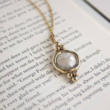 Harmony necklace with white stone, handmade artisan pendant in 24k gold plated brass on stainless steel chain, symbolic circle jewelry, boho gemstone necklace, unique handmade small business accessory by Sunny Designs Χειροποίητο κολιέ Harmony με λευκή πέτρα, μενταγιόν από επιχρυσωμένο ορείχαλκο και ατσάλινη αλυσίδα, affordable bohemian artisan jewelry, κομψό και πνευματικό κόσμημα Sunny Designs