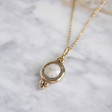 Harmony necklace with white stone, handmade artisan pendant in 24k gold plated brass on stainless steel chain, symbolic circle jewelry, boho gemstone necklace, unique handmade small business accessory by Sunny Designs Χειροποίητο κολιέ Harmony με λευκή πέτρα, μενταγιόν από επιχρυσωμένο ορείχαλκο και ατσάλινη αλυσίδα, affordable bohemian artisan jewelry, κομψό και πνευματικό κόσμημα Sunny Designs