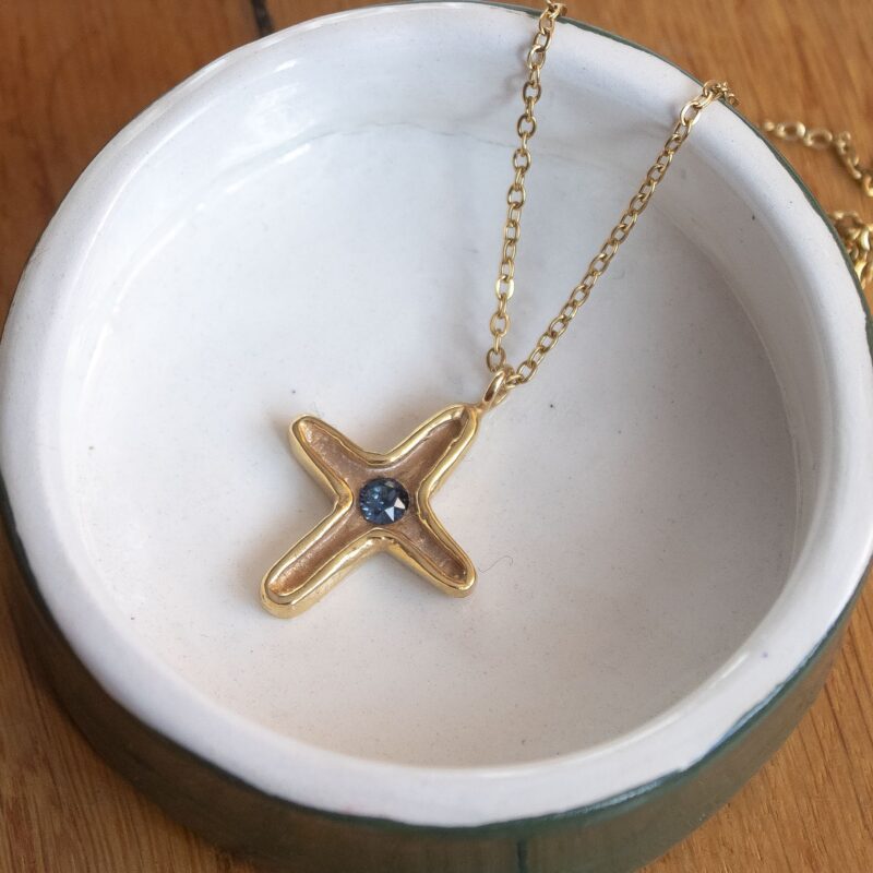 Maria’s Cross necklace with blue Swarovski stone, handmade artisan pendant in 24k gold plated brass on durable stainless steel chain, symbolic spiritual jewelry, boho cross necklace, unique handmade small business accessory by Sunny Designs , Κολιέ Maria’s Cross με μπλε πέτρα Swarovski, χειροποίητο μενταγιόν σταυρού από ορείχαλκο επιχρυσωμένο 24 καράτια σε ατσάλινη αλυσίδα, πνευματικό κόσμημα, boho χειροποίητο αξεσουάρ, μοναδικό κόσμημα μικρής επιχείρησης Sunny Designs