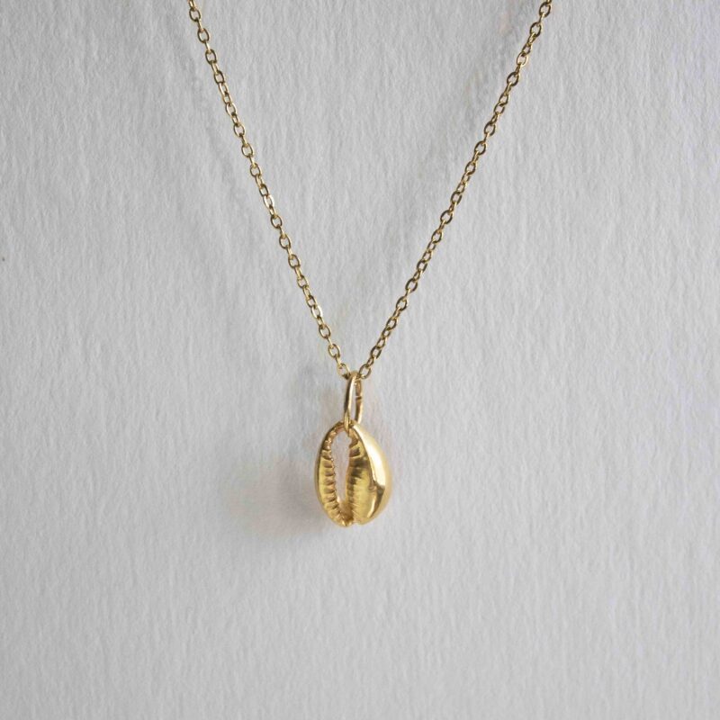 Lucky cowrie seashell necklace, handcrafted gold plated brass pendant on stainless steel chain, unique bohemian jewelry inspired by nature and the sea, small business handmade jewelry by Sunny Designs
