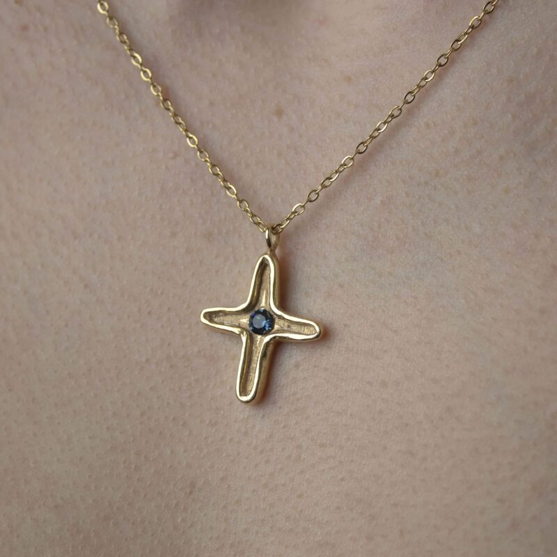 Maria’s Cross necklace with blue Swarovski stone, handmade artisan pendant in 24k gold plated brass on durable stainless steel chain, symbolic spiritual jewelry, boho cross necklace, unique handmade small business accessory by Sunny Designs , Κολιέ Maria’s Cross με μπλε πέτρα Swarovski, χειροποίητο μενταγιόν σταυρού από ορείχαλκο επιχρυσωμένο 24 καράτια σε ατσάλινη αλυσίδα, πνευματικό κόσμημα, boho χειροποίητο αξεσουάρ, μοναδικό κόσμημα μικρής επιχείρησης Sunny Designs