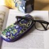 This elegant glasses case by CARMANI features Vincent van Gogh’s iconic painting Irises. Designed to protect your glasses while showcasing artistic beauty, it combines durability with style. The soft interior lining prevents scratches, making it perfect for everyday use or travel. A stylish accessory for art lovers and collectors.