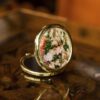 A charming compact mirror decorated with Vincent van Gogh’s romantic artwork Bouquet with Roses. Elegant and practical, it features a slim design that fits easily in any handbag or cosmetic pouch. Ideal for quick touch-ups on the go and a lovely gift for art lovers.