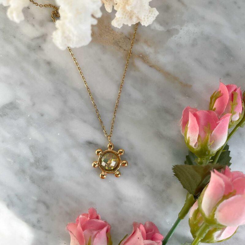 Handcrafted Starfire necklace by Sunny Designs with Iridescent White stone, featuring a 24k gold-plated brass circle pendant with delicate ball details on a stainless steel chain. Elegant, symbolic and feminine, this boho chic artisan necklace is perfect for everyday wear or a meaningful gift. Χειροποίητο κολιέ με λαμπερή λευκή iridescent πέτρα – ιδανικό για γυναίκες που αγαπούν minimal αλλά ξεχωριστά κοσμήματα.