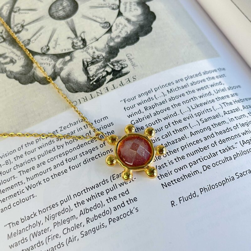 The Starfire Necklace by Sunny Designs captures celestial beauty with its star-inspired pendant and light purple stone. Handmade from brass, it radiates creativity, intuition, and calm. A delicate yet eye-catching accessory for everyday elegance.
