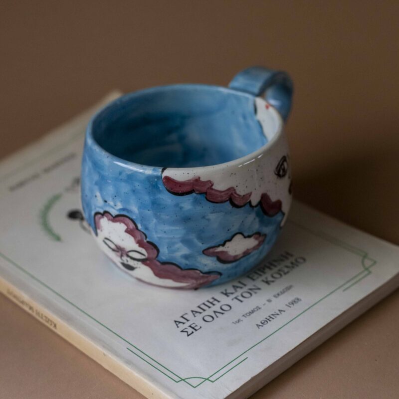 handmade ceramic mug with clouds and faces. an amazing perfect mug with celestial creatures perfect for capuccino and tea. Μια πανέμορφη χειροποίητη κούπα με συννεφάκια με πρόσωπα. Κατάλληλη για καπουτσίνο και τσάι.