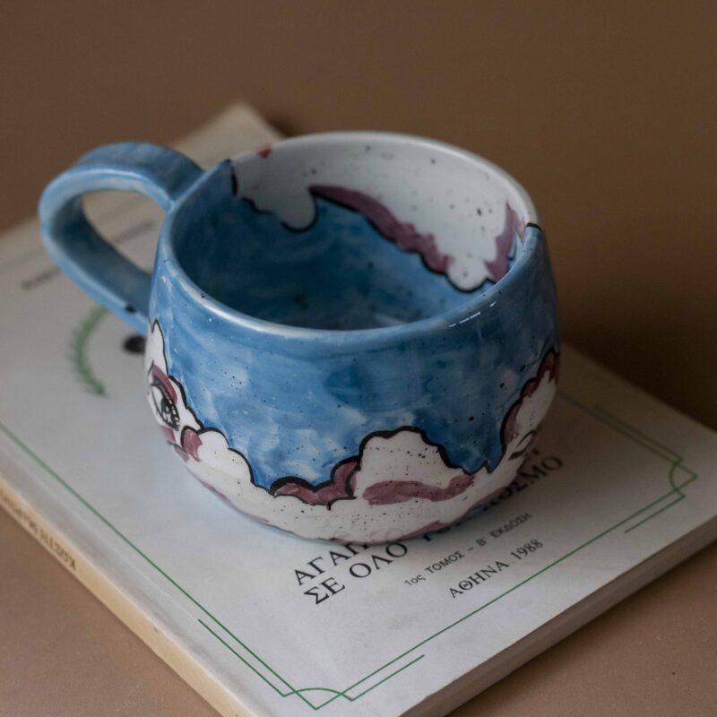 handmade ceramic mug with clouds and faces. an amazing perfect mug with celestial creatures perfect for capuccino and tea. Μια πανέμορφη χειροποίητη κούπα με συννεφάκια με πρόσωπα. Κατάλληλη για καπουτσίνο και τσάι.