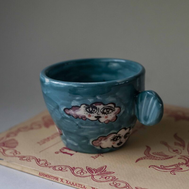 handmade ceramic mug with clouds and faces. an amazing perfect mug with celestial creatures perfect for capuccino and tea. Μια πανέμορφη χειροποίητη κούπα με συννεφάκια με πρόσωπα. Κατάλληλη για καπουτσίνο και τσάι.